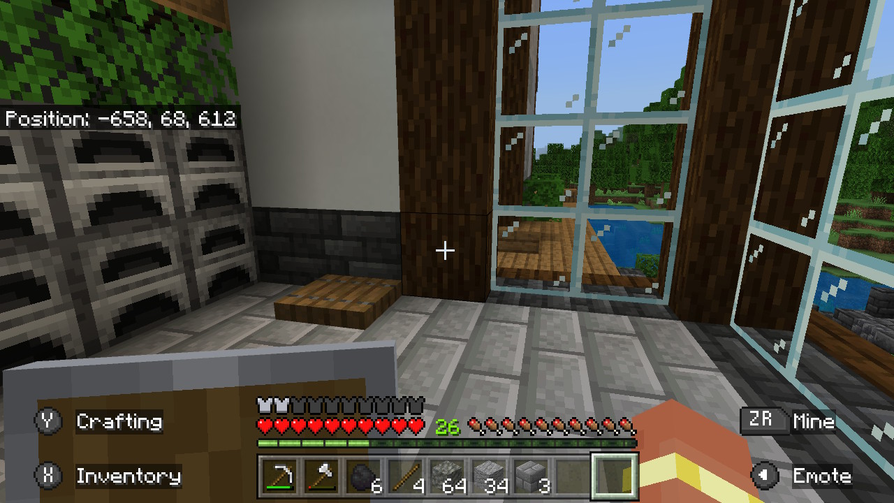 A wooden house with glass windows that cover the right side wall in Minecraft,